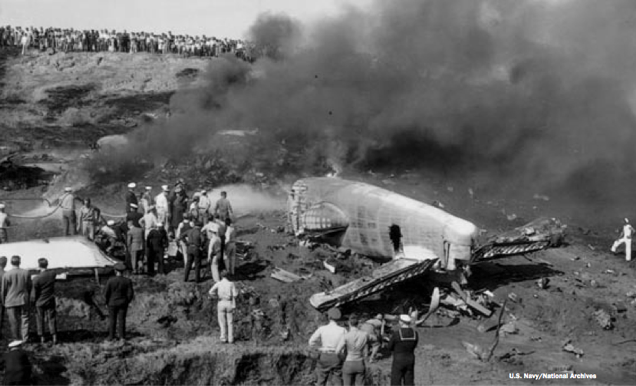 The wreck of Consolidated PB4Y-2 Privateer, Bu. No. 59554, burns on a hillside west of Lindbergh Field, 22 November 1944. (U.S. Navy)