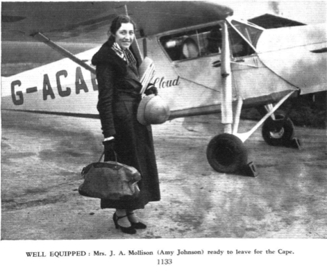 JOHNSON, Amy, CBE, with her de Havilland DH.80A Puss Moth, G-ACAB, The Desert Wind, at Lympne Aerodrome, 14 November 1932