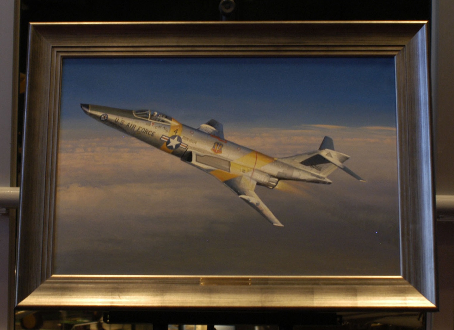 Schrek's Cin-Min on the Sun Run" by William S. Phillips at the National Museum of the United States Air Force, depicts Colonel Schre 's McDonnell RF-101C Voodoo. (U.S. Air Force)