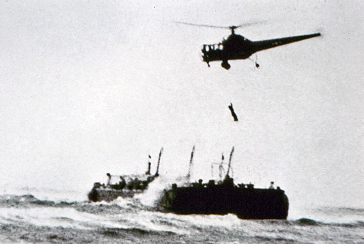 A Sikorsky R-5 flown by Jimmy Viner with Captain Jack Beighle, lifts a crewman from Texaco Barge No. 397, aground on Penfield Reef, 29 November 1945. (Sikorsky Historical Archive)
