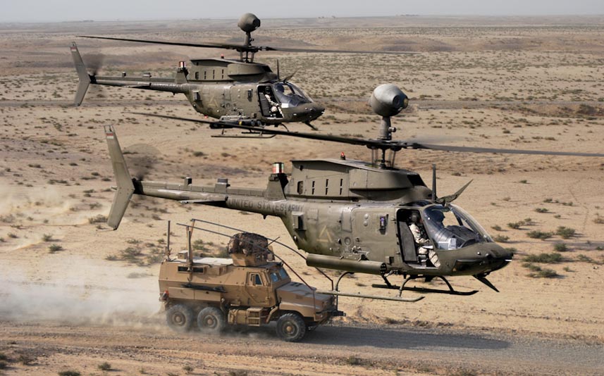 A flight of Bell OH-58D Kiowa Warriors scouting in a war zone. (U.S. Army)