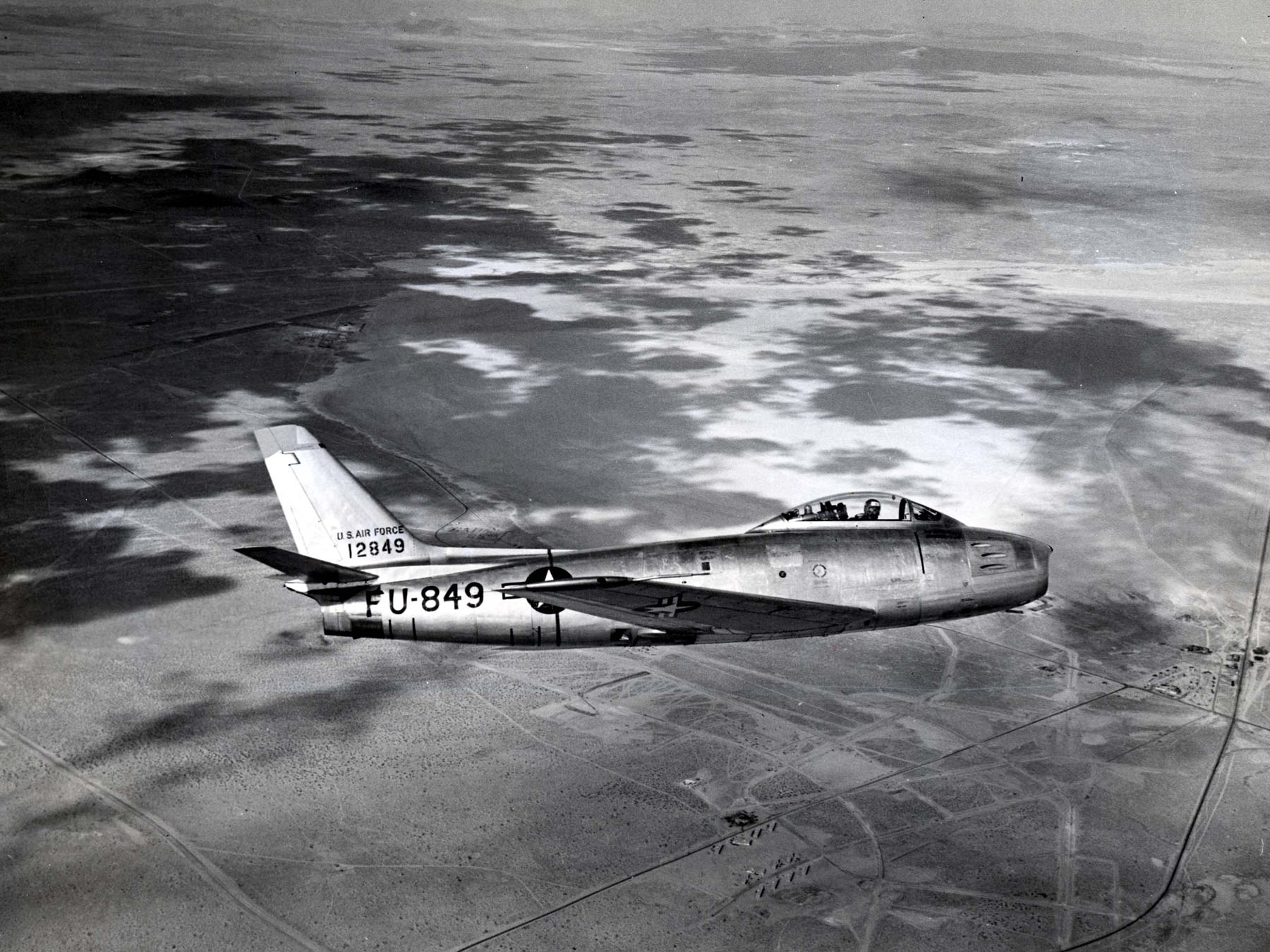 This North American Aviation F-86E-10-NA Sabre, 51-2849, seen here in flight over Edwards Air Force base, california, is the same type fighter that was flown by Major George Davis, 13 December 1951. (U.S. Air Force)