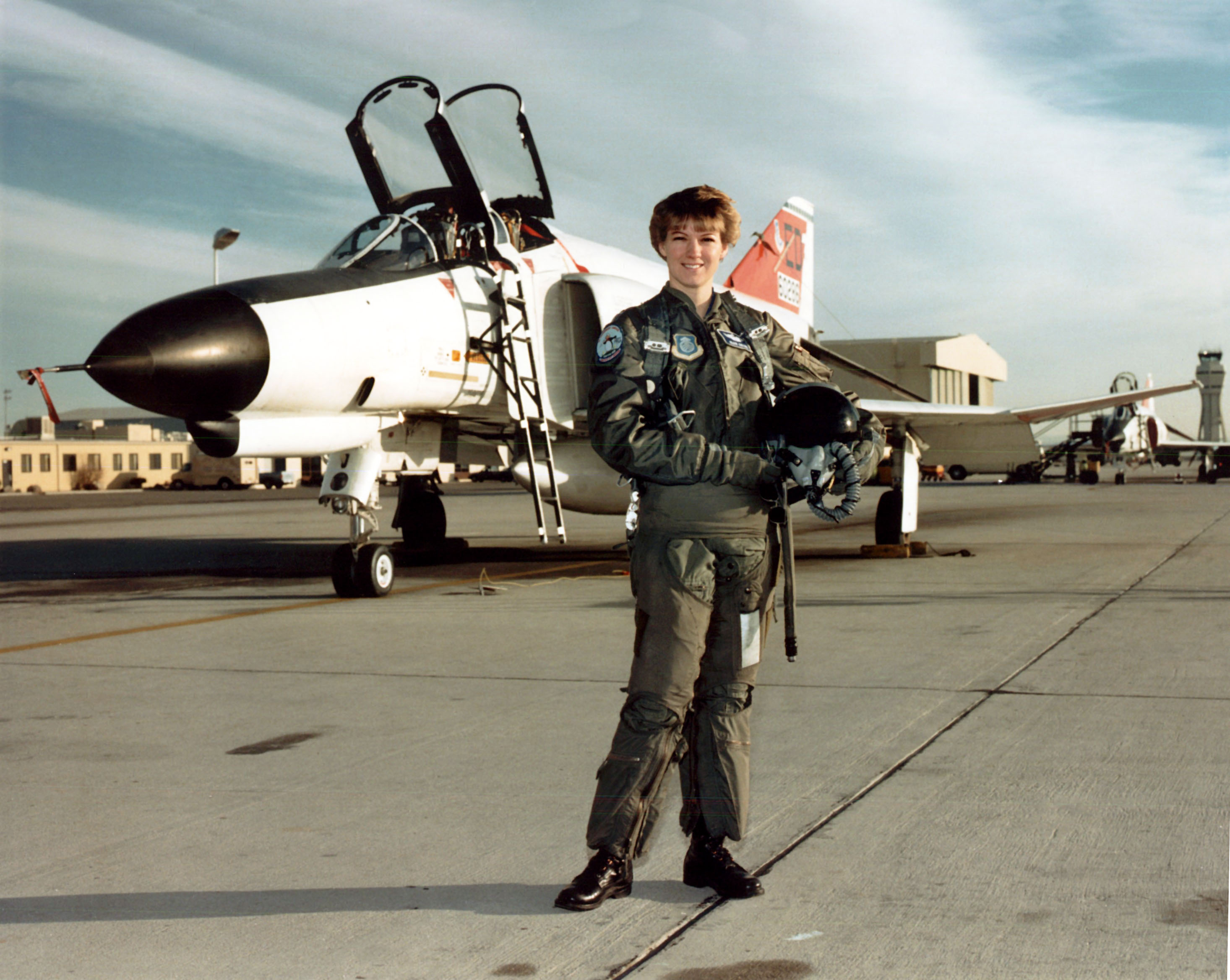 Major Eileen M. Collins with F-4E-31-MC Phantom II, 66-0289, at the Air Force Test Pilot School, Edwards Air Force Base, California, 1990. A pilot instructor on the T-38 Talon and C-141 Starlifter, Eileen Collins graduated from Class 89B at Edwards. Accepted as an astronaut for NASA, she piloted the space shuttle Discovery on mission STS-63, Atlantis, STS 84, and commanded Columbia STS-93 and Discovery, STS-114.(U.S. Air Force)