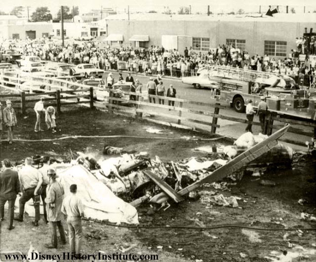 The crash scene of Los Angeles Airways Flight 841, along Alondra Blvd, Paramount, California, 22 May 1968. One main roto rblade can be seen protruding from a building's roof, nearby. (Unattributed)