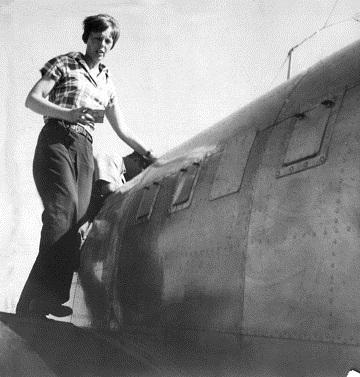 Amelia Earhart on the wing of her Electra at Darwin, Northern Territory, Australia, 28 June 1937. (Unattributed)