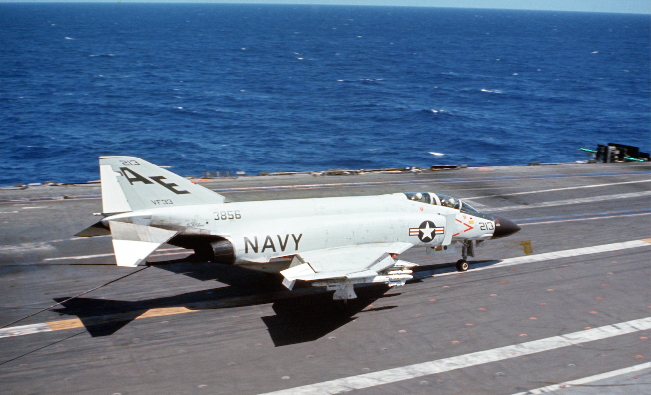 McDonnell F-4J-31-MC Phantom II, Bu. No. 153856, of Fighter Squadron Thirty-Three (VF-33) lands aboard USS America (CVA-66) circa 1968. This Phantom is a squadron mate of Root Beer 210. (U.S.Navy)