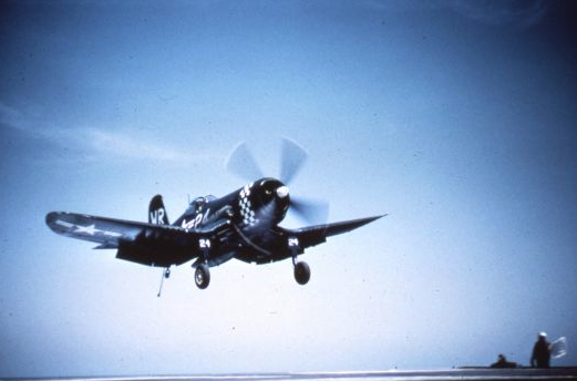 A U.S. Marines F4U Corsair of VMF-312 about to land aboard an aircraft carrier during the Korean War. This is the same type fighter flown by Captain. J.V. Wilkins on 3 July 1951. (U.S. Navy)