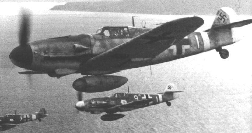 A flight of Messerchmitt me 109s carry external fuel tanks to extend their range and time over target. (Deutsches Bundesarchiv)