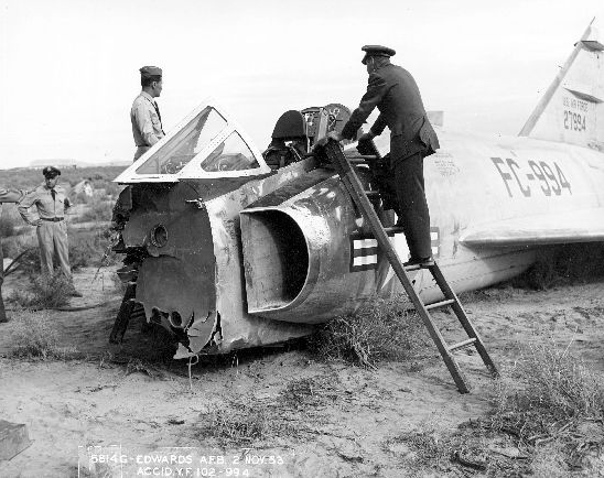 Air Force officers examine the wreck of teh prototype Convair YF-102, 52-994, near Edwards AFB, 2 November 1953. (San Diego Air and Space Museum Archives)