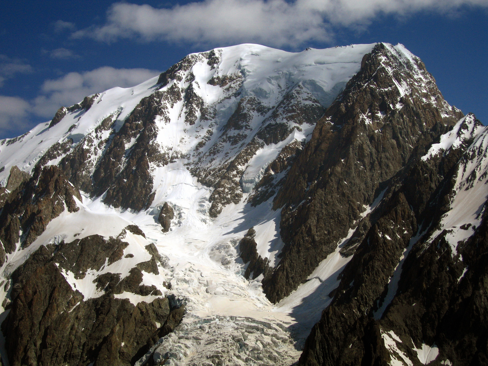 Mont Blanc, western face. The summit was most recently measured at 4,810.06meters. 18 meters of snow and ice cover the actual rock peak, at 4,792 meters.