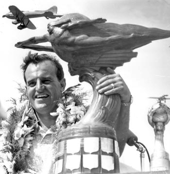 1949 ace winner Joe De Bona with the Bendix Trophy. De Bona flew Thunderbird in the 1948 and 1949 air races. (Unattributed)