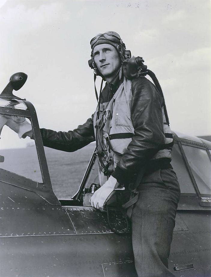 Lieutenant Willard W. Millikand, 336th Fighter Squadron, 4th Fighter Group, 8th Air Force, U.S. Army Air Force, stands in the cockpit of his Republic P-47C Thunderbolt 41-6180. (American Air Museum in Britain, Object Number UPL 18911)