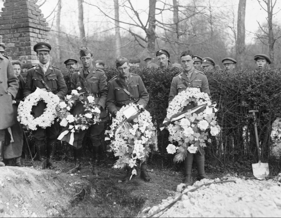 "Four officers placing wreaths from British Squadrons on the grave. Bartangles, 22 April 1918." (Imperial War Museum, Catalog number Q 10923)