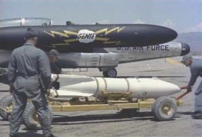 A Douglas MB-1 Genie nuclear-armed air-to-air rocket is loaded aboard the F-89 Scorpion in preparation for Operation Plumbbob John. (U.S. Air Force)