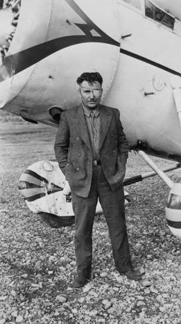 A very tired Wiley Post photographed at Flat, Alaska, after Winnie Mae has been repaired. (University of Alaska image identifier UAF-1998-129-3)