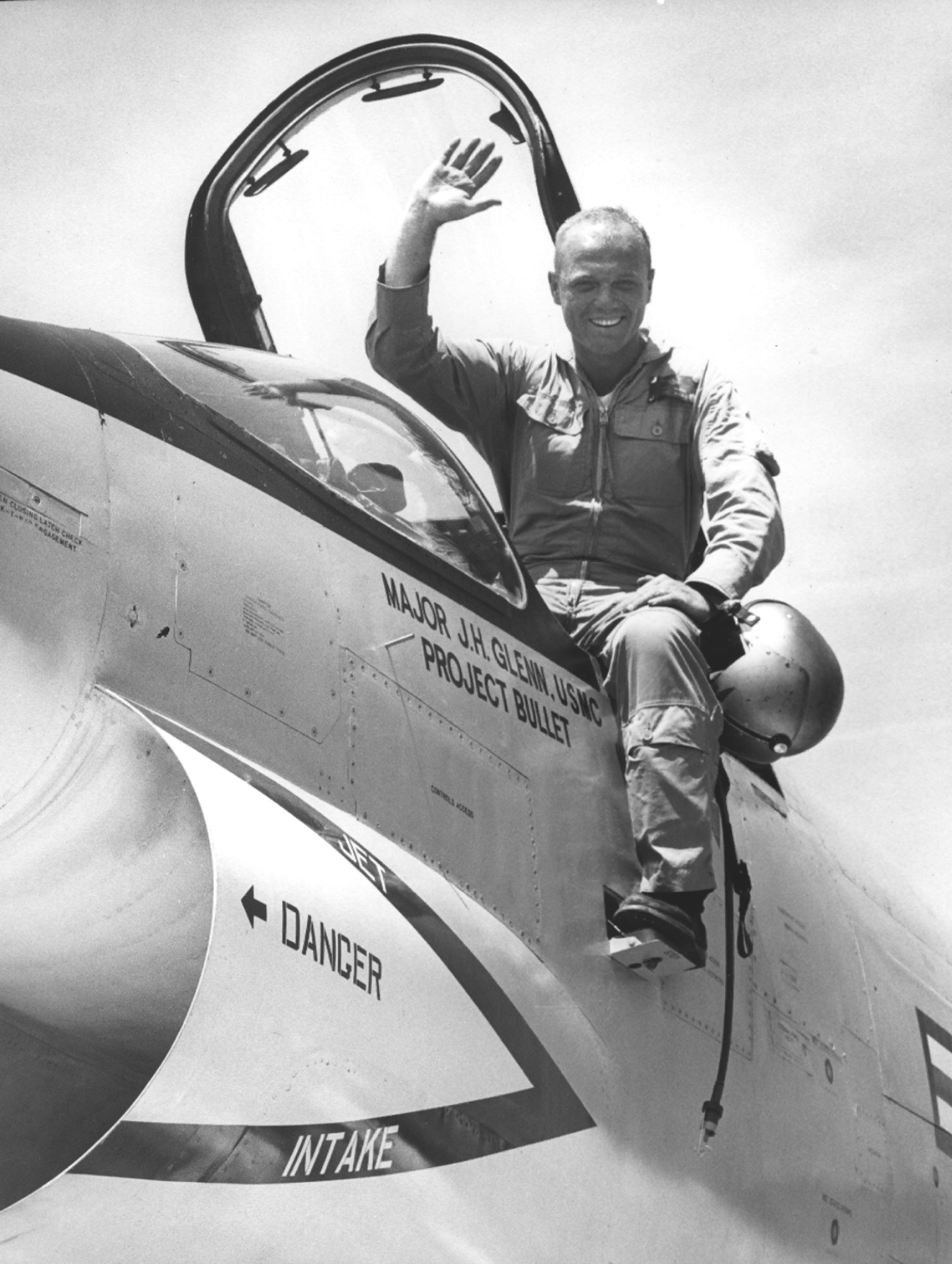 Major John H. Glenn, Jr., United States Marine Corps, with his Vought F8U-1P Crusader, Bu. No. 144608, after his record-setting flight, 16 July 1957. (U. S. Navy)