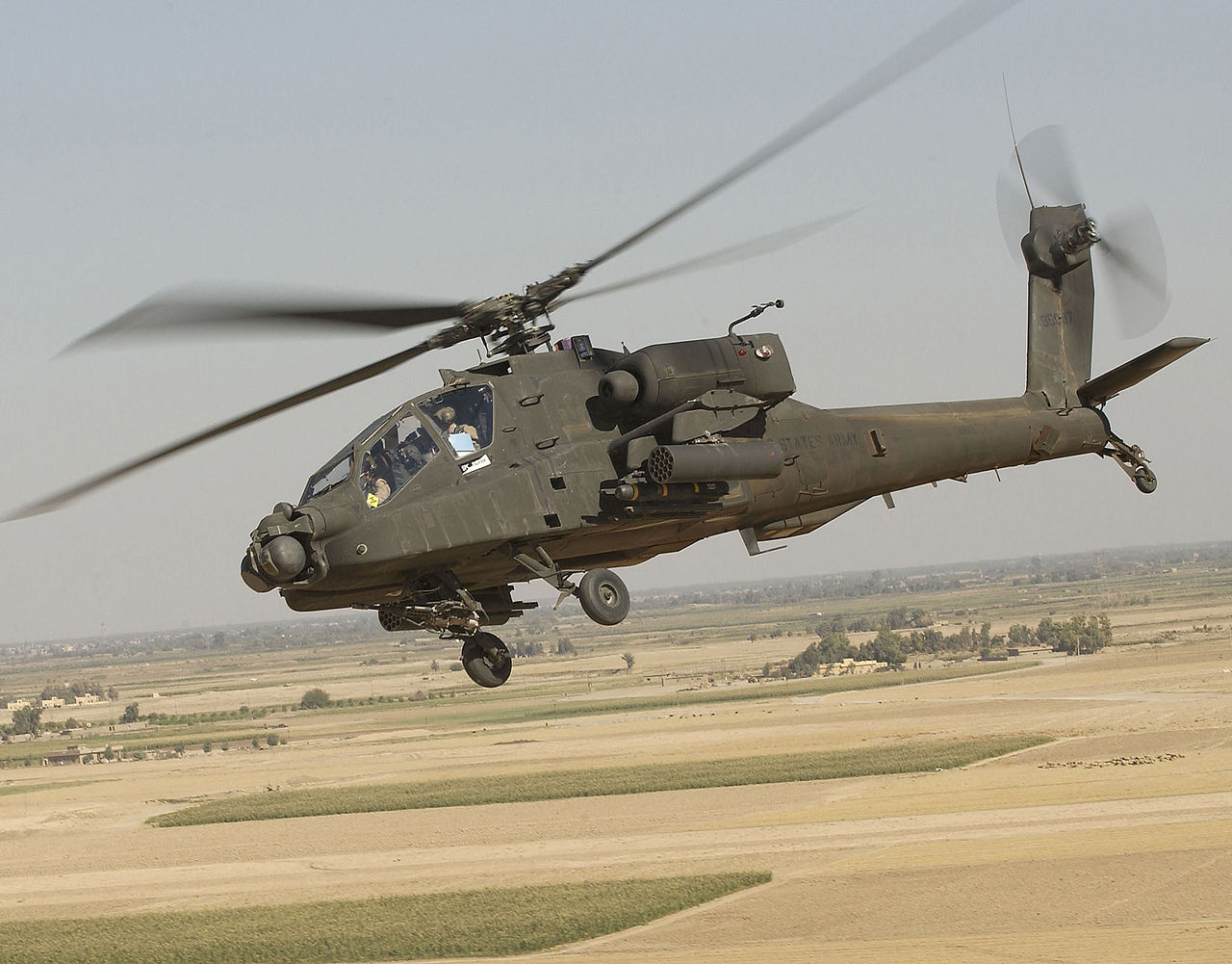 An AH-64 Apache Longbow 99-05097 over Iraq, 2005. This aircraft was originally AH-6A A Apache 84-24287, before being remanufactured at Mesa, Arizona to the Longbow configuration, (TSGT Andy Dunaway/U.S. Army)