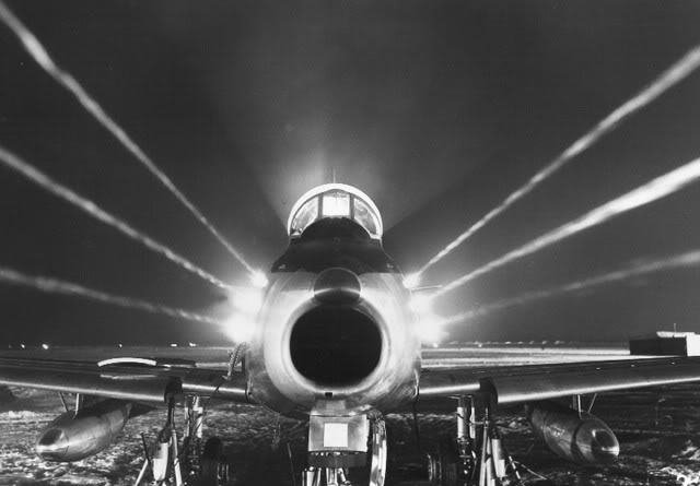 This photograph of a Canadair CL-13 Sabre, a license-built F-86E, shows the firepower of the six .50-caliber machine guns placed close together in the airplane's nose. The smoke trails show the spin of the bullets caused by the gun barrels' rifling. (Royal Canadian Air Force)