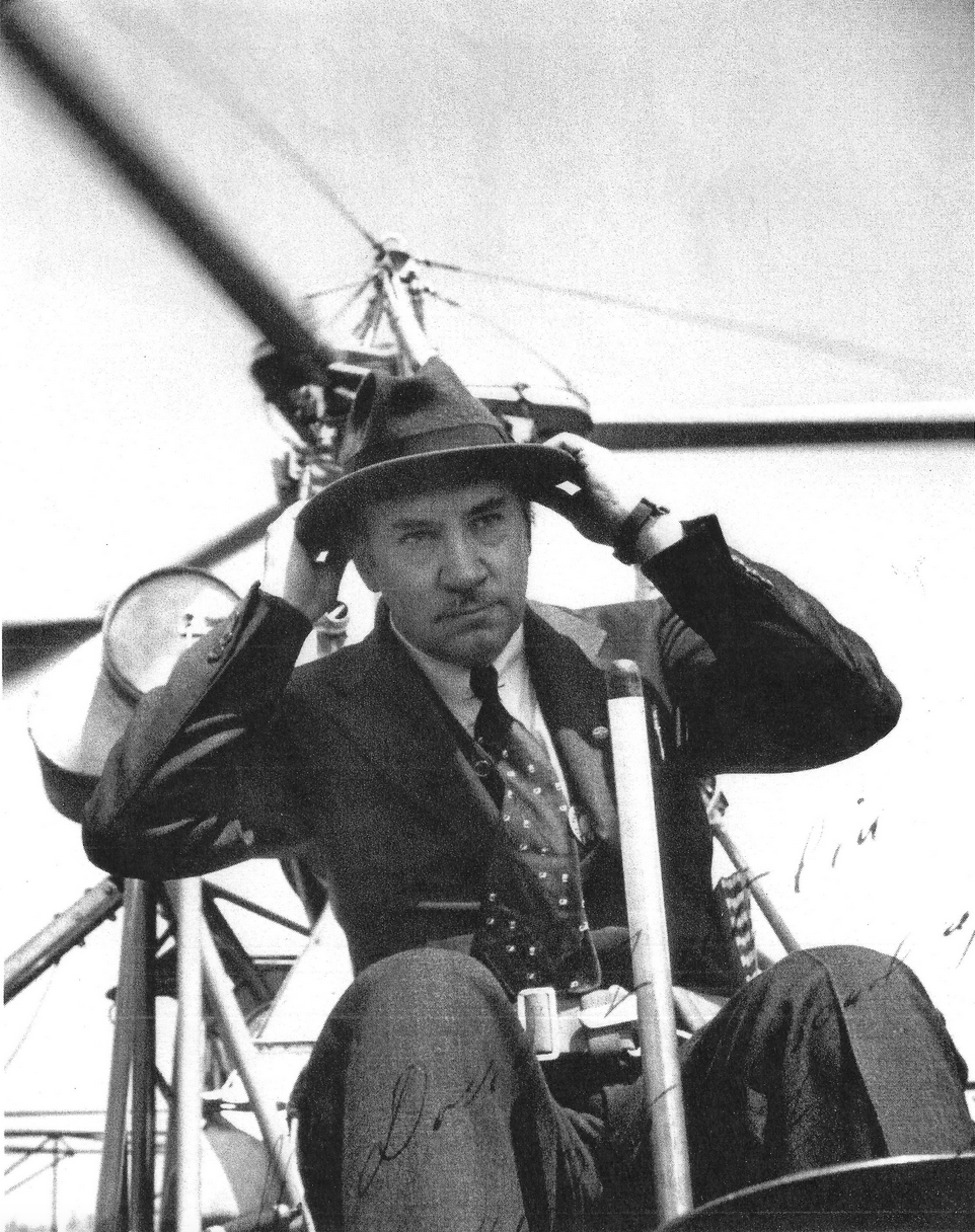 Igor Sikorsky adjusts is fedora while at teh controls of the VS-300. (Sikorsky Historical Archives)