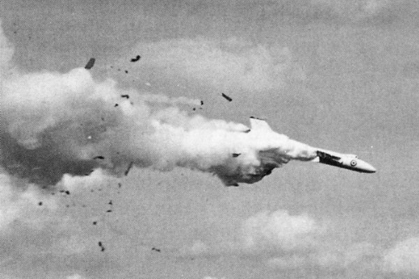 Clouds of vaporized fuel trail the doomed bomber.