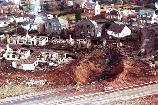The impact crater of Boeing 747 N739PA at Sherwood Crescent, Lockerbie. The wings and fuselage center section struck here, 49.5 seconds after the explosion. 200,000 pounds (91,000 kilograms) of jet fuel ignited, destroying many homes. (Martin Cleaver/syracuse.com)