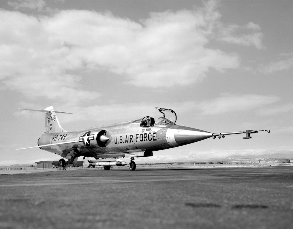 NASA 749, a Lockheed JF-104A Starfighter, 56-749, with an ALSOR sounding rocket on a centerline mount, at Edwards Air Force Base. Right front quarter view. (NASA)