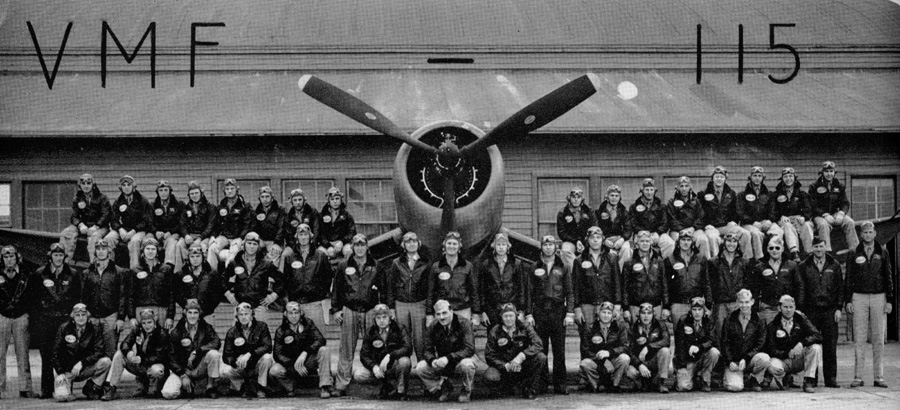 Marine Fighter Squadron 115 (VMF-115) at MCAS Santa Barbara, Goleta, California, 1944. Major Joe Foss is in th e center of the back row, wearing flight helmet with goggles, standing in front the of Corsair's propeller blade.