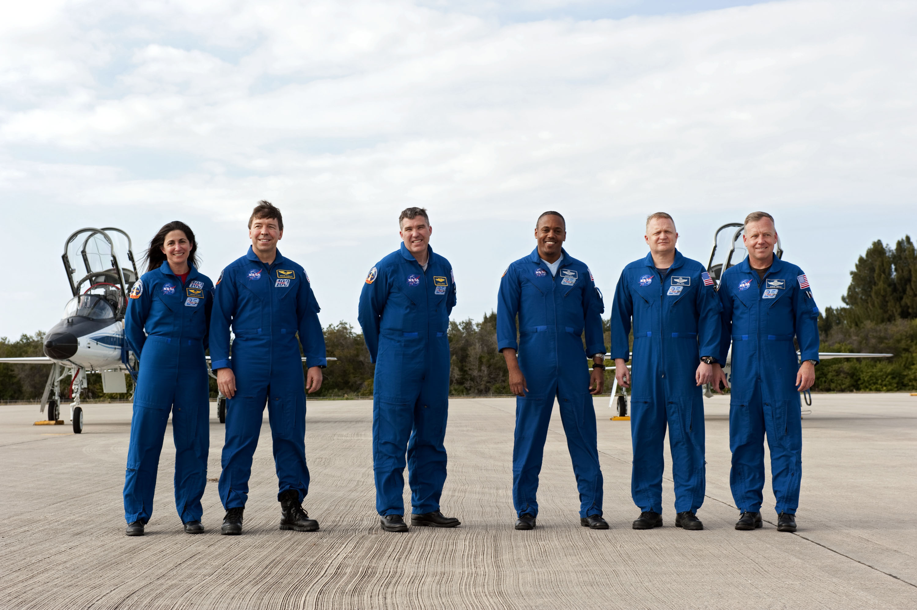 Crew of Discovery (STS-133). Left to right, Nicole Stott, Michael Barratt, Steve Bowen, Alvin Drew, Eric Boe and Steve Lindsey. (NASA)