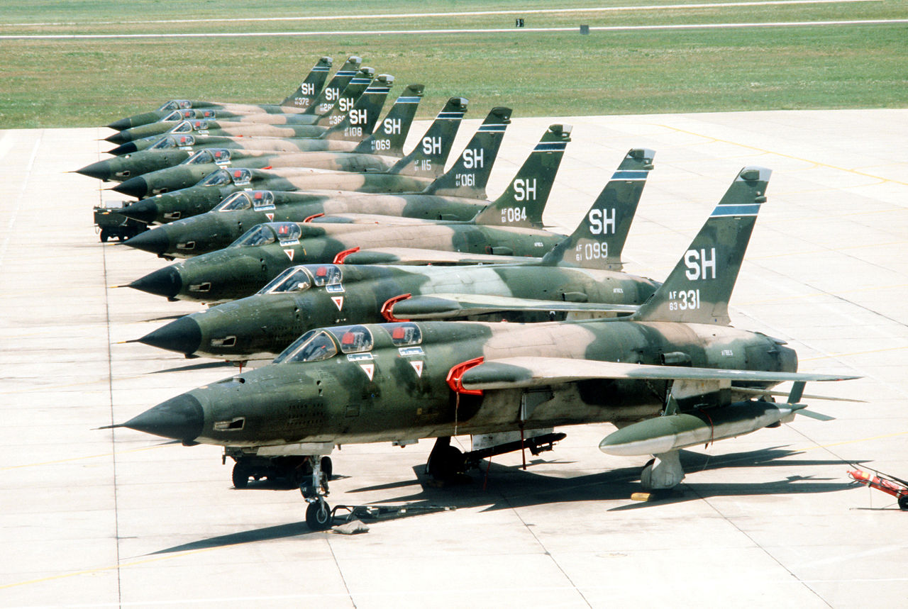 A Republic F-105F Thunderchief (foreground) and nine F-105Ds of the U.S. Air Force Reserve 465th Tactical Fighter Squadron, 507th Tactical Fighter Group (later 301st TFW), on the flight line at Tinker Air Force Base, Oklahoma (USA), on 1 June 1978. (Camera Operator: Rick Diaz - U.S. Defense Visual Information Center photo DF-ST-86-12883)
