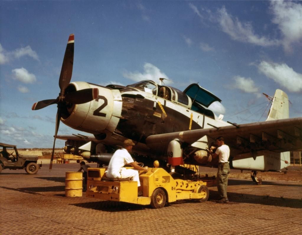 Bombs are loaded aboard Douglas A-1E Skyraider 52-132649 between missions, South Vietnam, 1966. (U.S. Air Force via Warbird Information Exchange)