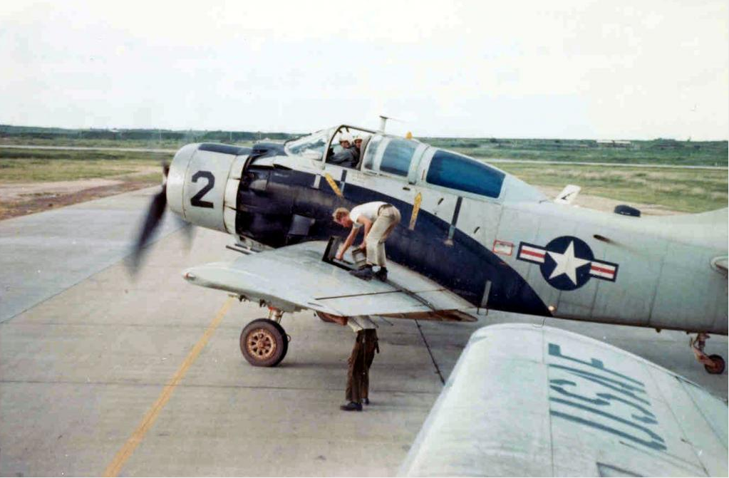 While its engine idles, Douglas A-1E Skyraider 52-132649 is reamermed, Vietnam, 1966. (U.S. Air Force via Warbird Information Exchange)