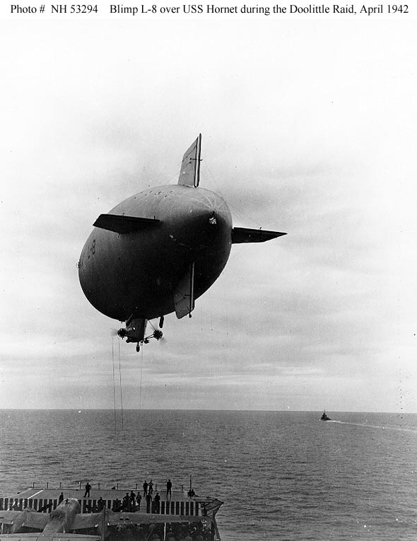 4 April 1942: A U.S. Navy airship delivers parts from the West Coast for Doolittle's B-25 bombers to USS Hornet (CV-8) somewhere in the Pacific. (U.S. Navy)