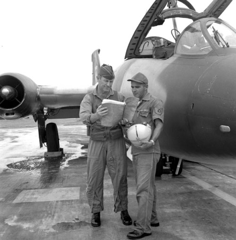 Colonel Charles E. ("Chuck") Yeager, USAF, commanding the 405th Fighter Wing, with crew chief TSGT Rodney Sirois, before a combat mission with a Martin B-57 Canberra during the Vietnam War. (Andrew Headland, Jr./Stars and Stripes)