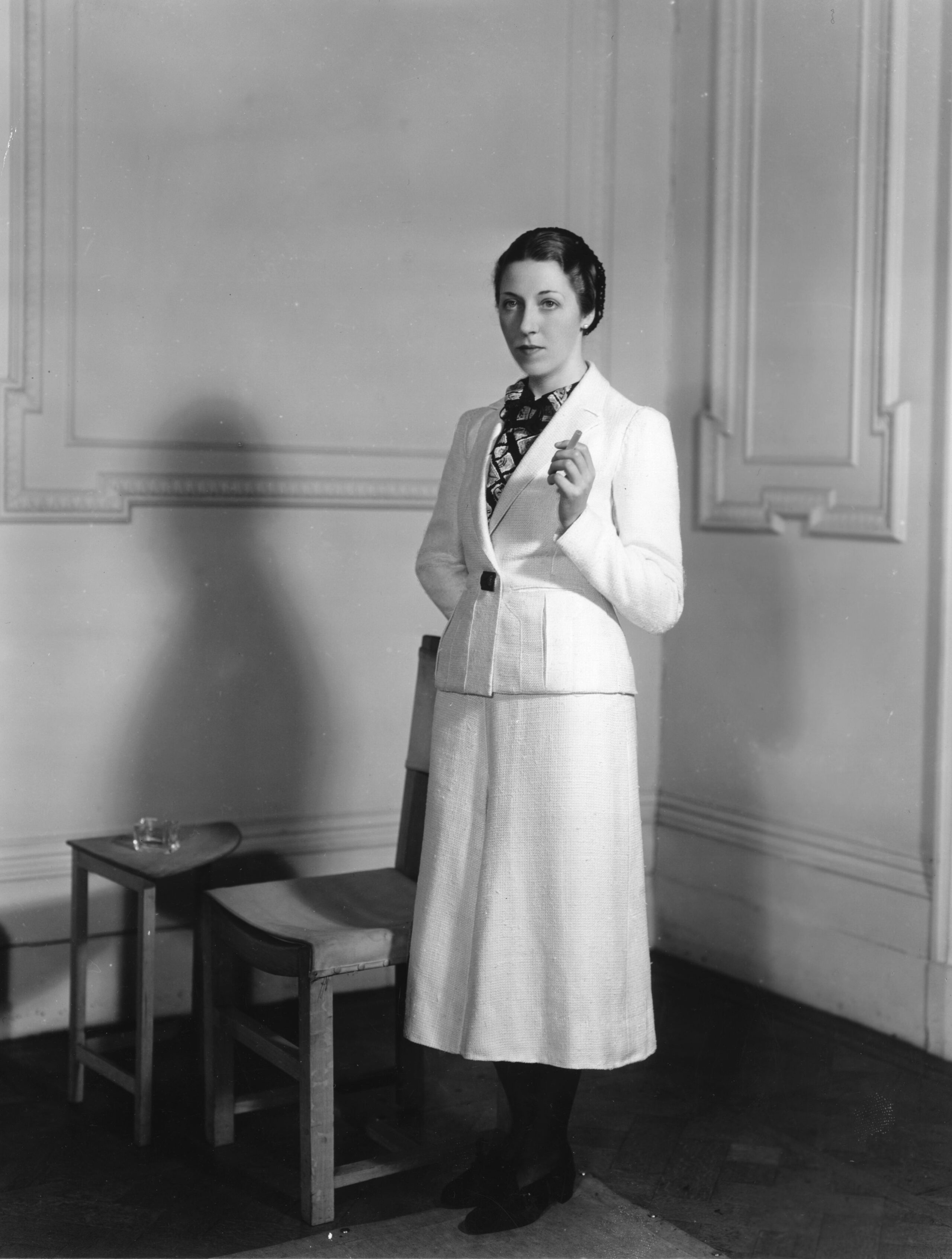 1st April 1936: English aviator Amy Mollison, nee Johnson (1903 - 1941) wearing a woollen suit from the collection of flight clothes designed by Madame Schiaparelli for her solo flight from London to Cape Town. (Photo by Sasha/Getty Images)