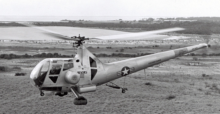 U.S. Coast Guard HOS-1 (Sikorsky S-49), with Igor Sikorsky as a passenger, over the Kill Devil Hills, North Carolina, 17 December 1947—the 44th annivesary of teh Wright Brothers first controlled, powered airplane flight. (Sikorsky Historical Archives)