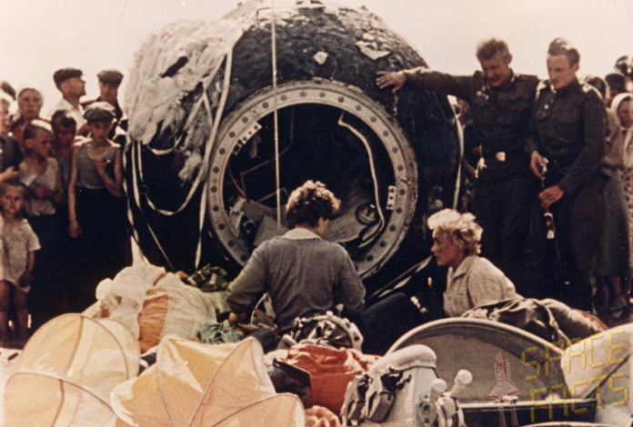 Tershkova (center, with back toward camera) with the Vostok descent module, (Space Facts)