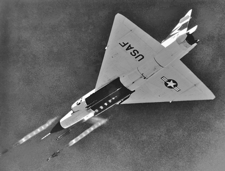 A Convair F-102A Delta Dagger launches three AIM-4 Falcon guided missiles. (U.S. Air Force)