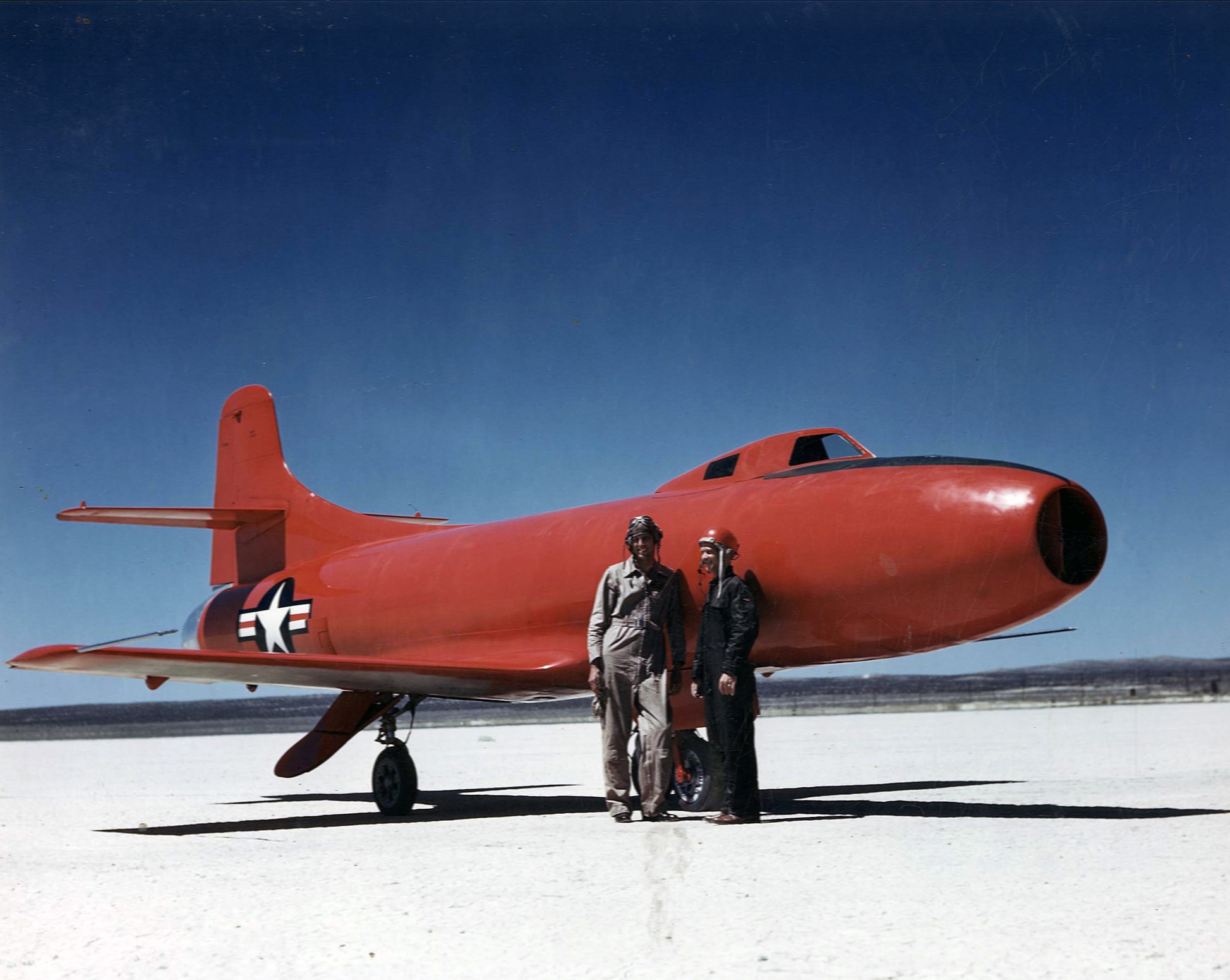 Major Marion E. Carl, USMC, left, and Commander Turner F. Caldwell, Jr., USN, stand with the record-setting Douglas D-558-I Skystreak, Bu. No. 37970, on Muroc Dry Lake. (U.S. Navy)