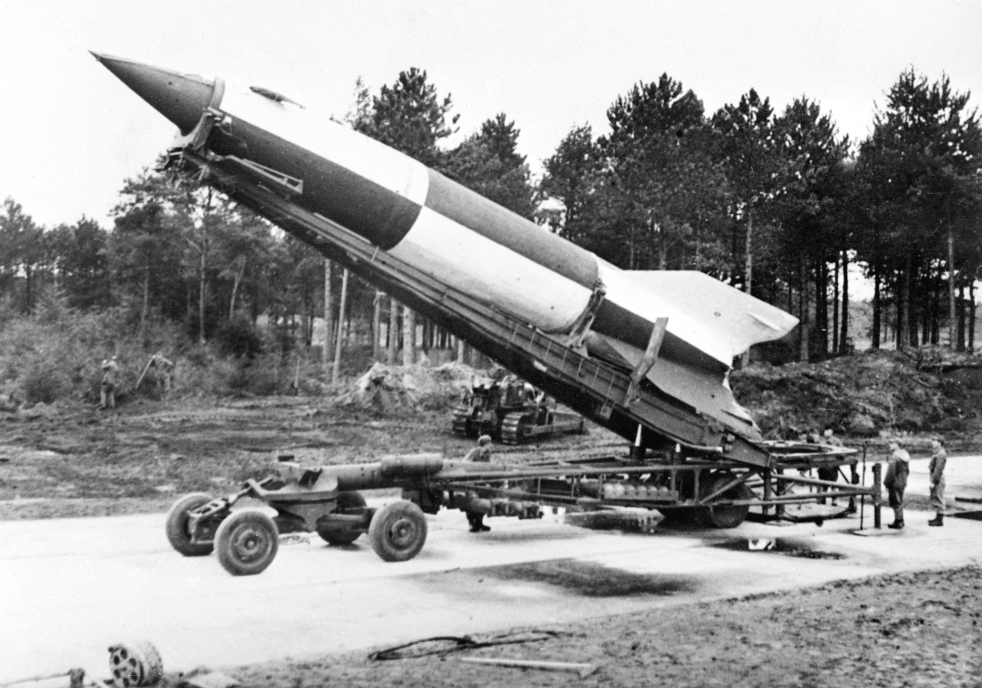 A V-2 rocket is being raised to a vertical position for firing.