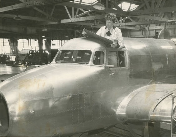 Amelia Earhart Standing In The Cockpit Of Of The Lockheed Electra E