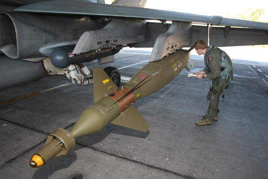 A Royal Australian Air Force fighter pilot checks a GBU-10 Paveway II 2,000-pound laser-guided bomb on an F-18 Hornet. This is the same type of bomb used by Captains and Bakke to destroy an Iraqi Mil Mi-24 Hind attack helicopter.(RAAF)