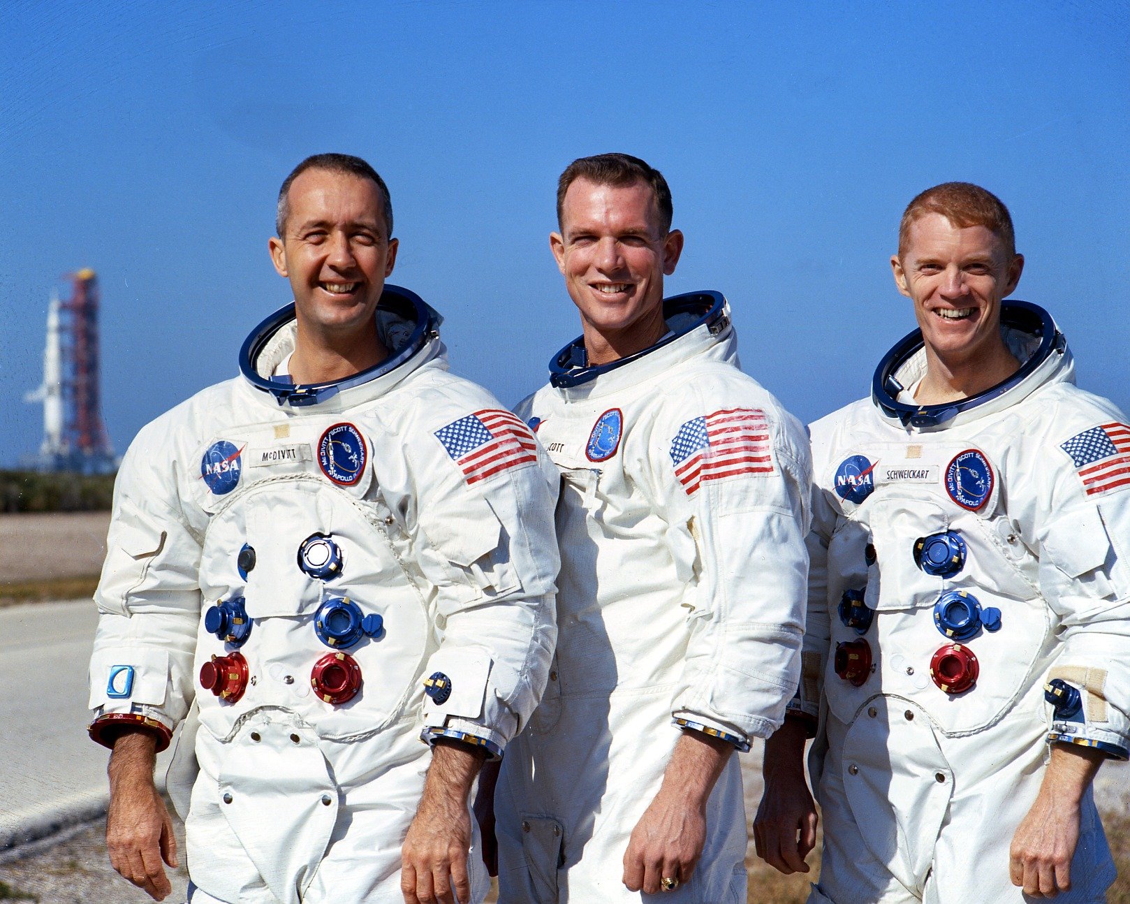 The flight crew of Apollo 9, James A. McDivitt, David R. Scott and Russell L. Schweickart. SA-504 is in the background. (NASA)