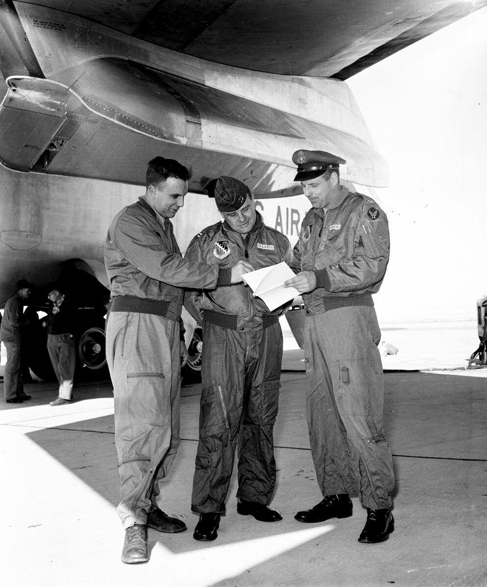 The NB-52A Stratofortress flight crew, left to right: Harry W. ("Bill") Berkowitz, NAA, Launch Panel Operator; Captain John E. ("Jack") Allavie, USAF, Pilot; Captain Charles C. Bock, Jr., USAF, Aircraft Commander, at Edwards AFB, 7 February 1959. (U.S. Air Force)
