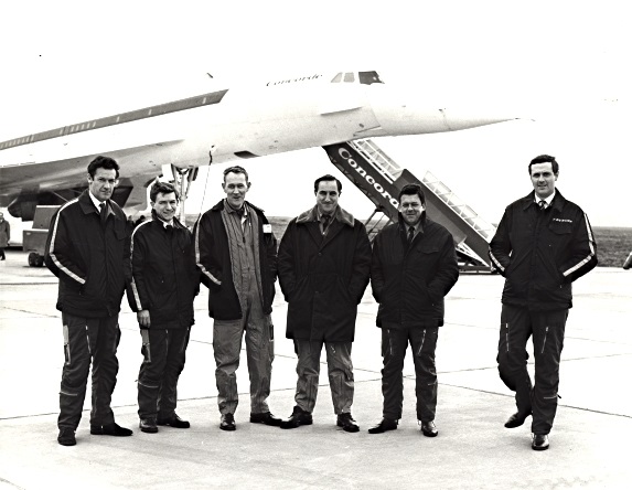 "Concorde 002 on April 9th 1969 ready for a test flight. The flight crew pose before take-off. From left to right, John Allan and Mike Addley (Flight test Observers) John Cochrane, co-pilot, Brian Trubshaw, pilot; Brian Watts, engineer and Peter Holding (Flight Test Observer)." (Stan Sims/Filton Library)