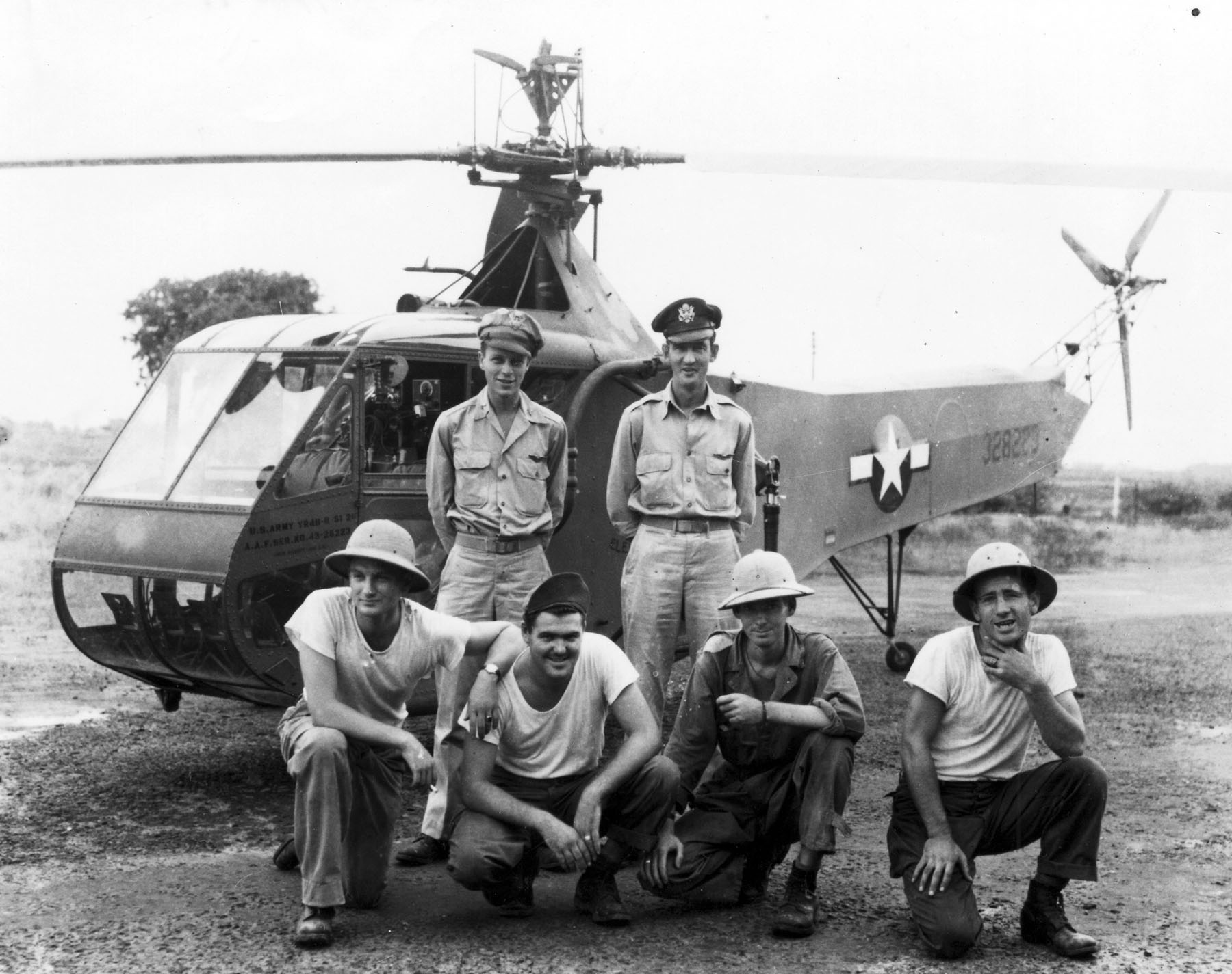 Lieutenant Carter Harman (standing, left), 1st Air Commando Group, with Sikorsky YR-4B-8-SI 43-28223, Burma, 26 April 1944. (U.S. Air Force)