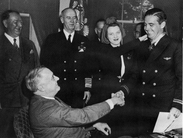 (Left to right) Secretary of the Navy Frank Knox, President Franklin D. Roosevelt, Admiral Ernest J. King, U.S. Navy, Mrs. O'Hare, Lt. (j.g.) Edward H. O'Hare, U.S. Navy.
