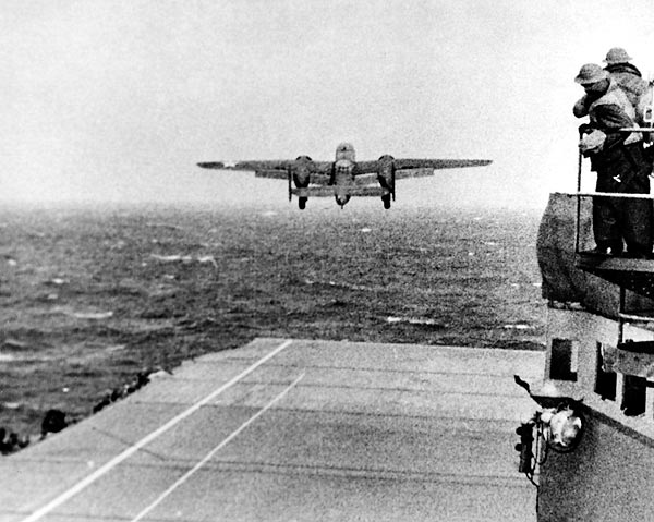 A B-25 is airborne over the bow of USS Hornet (CV-8). (U.S. Navy)