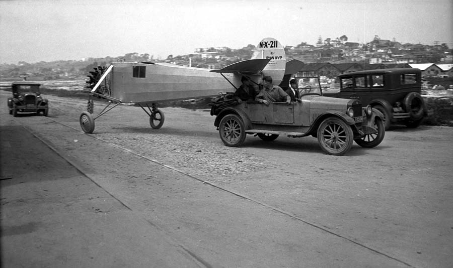 Charles Lindbergh watches as the Spirit of St. Louis is towed from the Ryan factory to Dutch Flats for testing. (Donald A. Hall Collection)