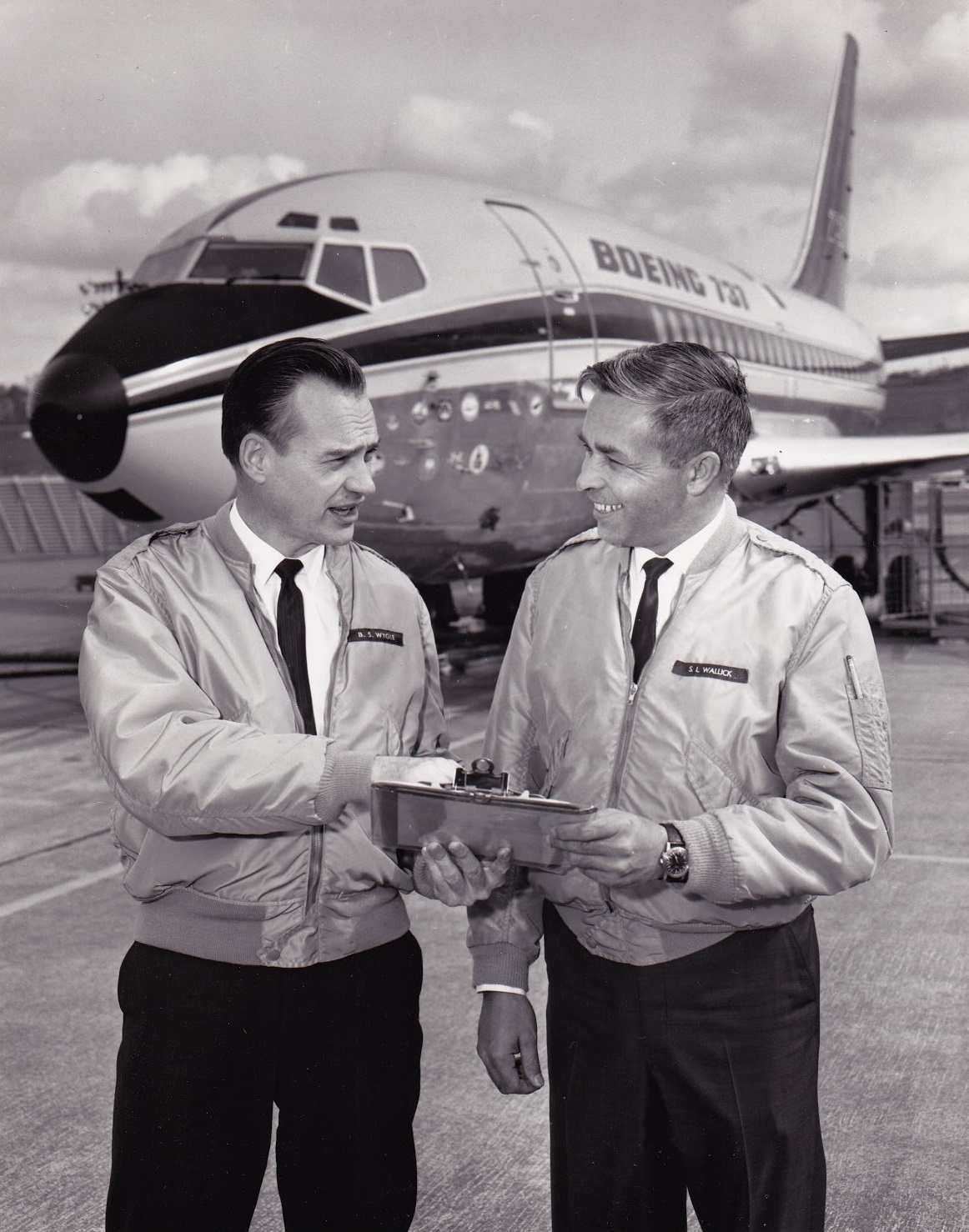 Boeing test pilots Brien Wygle and Lew Wallick with the prototype 737 airliner, N73700. (Boeing)