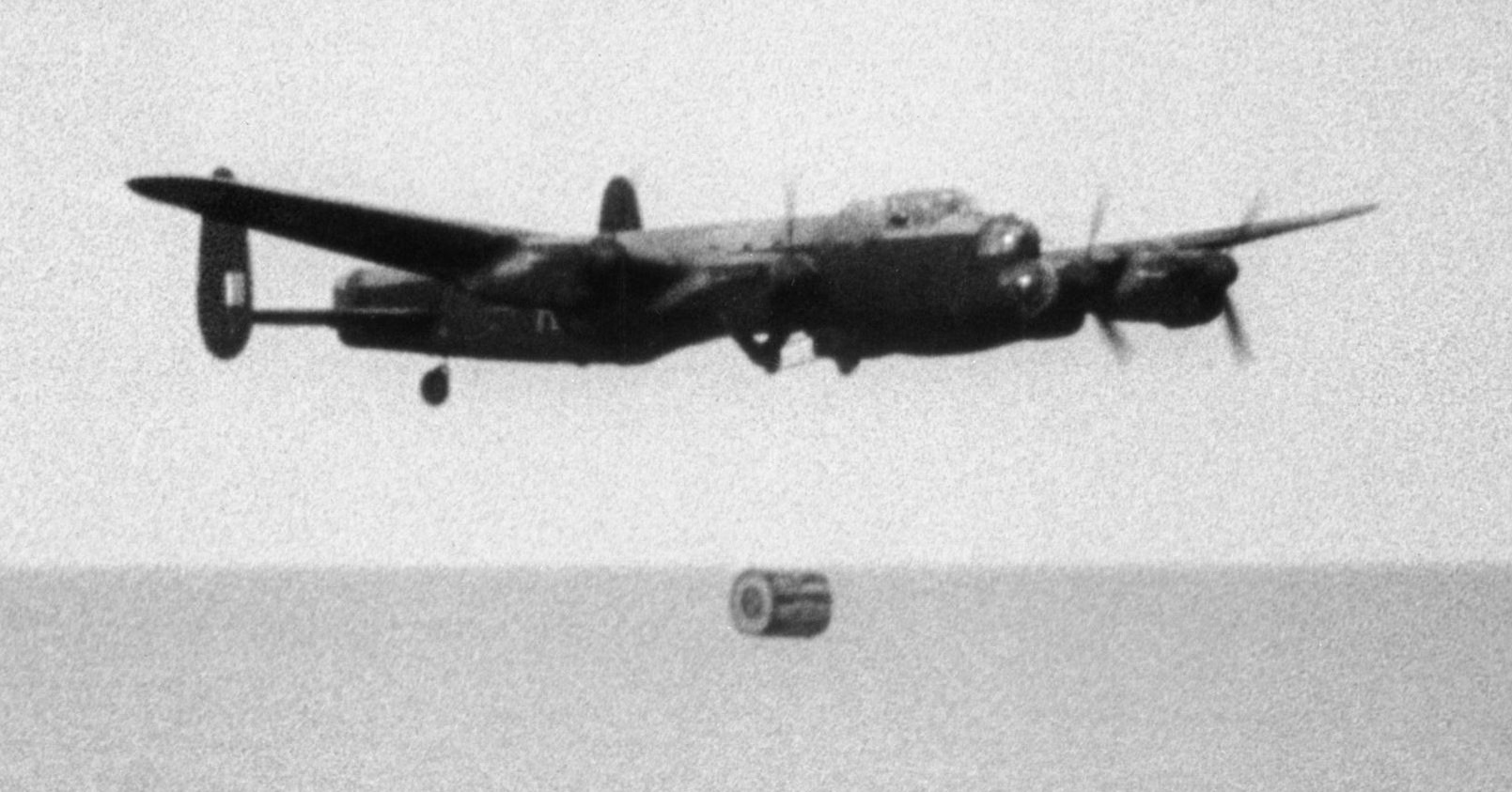 An Avro Lancaster B.III Special drops an "Upkeep" bomb during tests, April 1943. (Imperial War Museum)